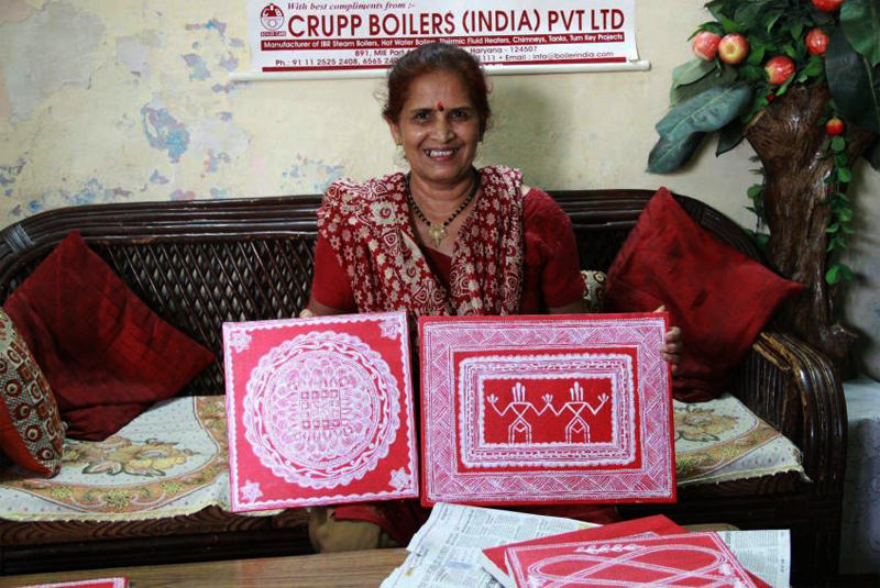 A Kumaoni Lady showing Aipan Art work - Kumauni Culture